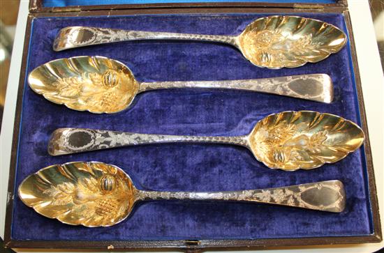 Cased 4 Georgian III silver and silver gilt berry spoons